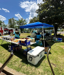 A food table being set up for Pickens’ Community Health Fair at the Tom Bevill Lock and Dam in Pickensville, AL.