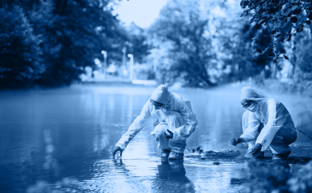 Two water quality testers take samples from a river, blue wash over image