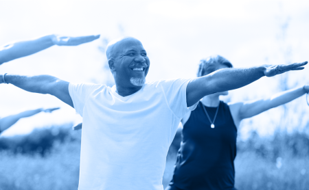 Man does outdoor yoga, blue wash over image