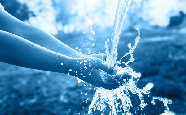 Hands under a stream of running water