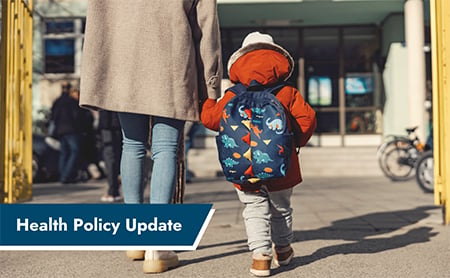 Parent and child walk hand-in-hand up school. ASTHO Health Policy Update banner, lower left