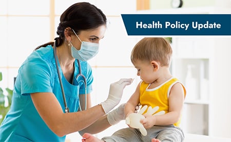A doctor prepares a happy toddler for a childhood vaccination.  ASTHO Health Policy Update banner in the upper right