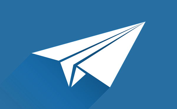 Icon paper airplane flying across a blue field