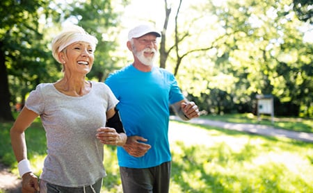 Senior citizens power walk in a park