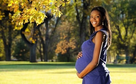 Smiling-pregnant-woman-in-park_1200x740.jpg