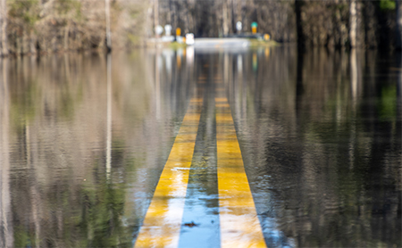 A submerged road under water after a natural disaster