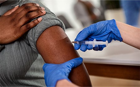 vaccine-equity-covid-shot-in-arm.jpg