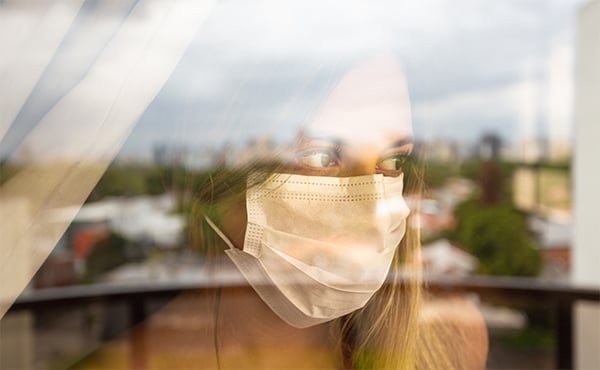 https://www.astho.org/globalassets/images/woman-wearing-protective-face-mask-looks-out-window.jpg